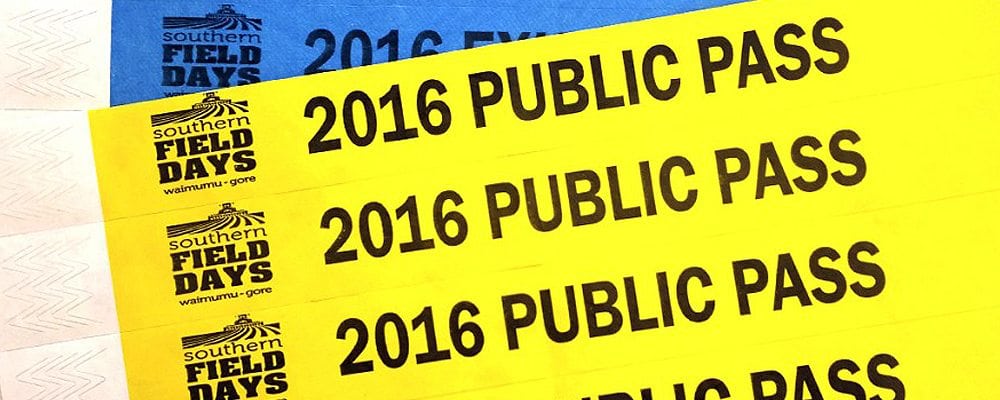 Yellow and blue Tyvek event wristbands printed with a public pass message